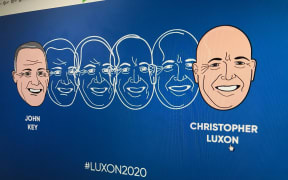The ad is a reworking of Dick Frizzell's well-known artwork "Mickey to Tiki" showing John Key's face transforming into Christopher Luxon's.