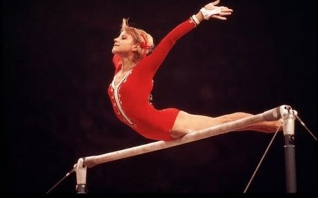 Olaga Korbut competing at the 1976 Olympics in Montreal.