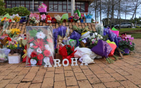 Flowers outside the Henderson police station in memory of Constable Matthew Hunt.