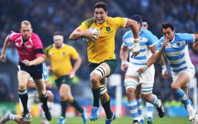Wallabies lock Rob Simmons runs towards the try line.