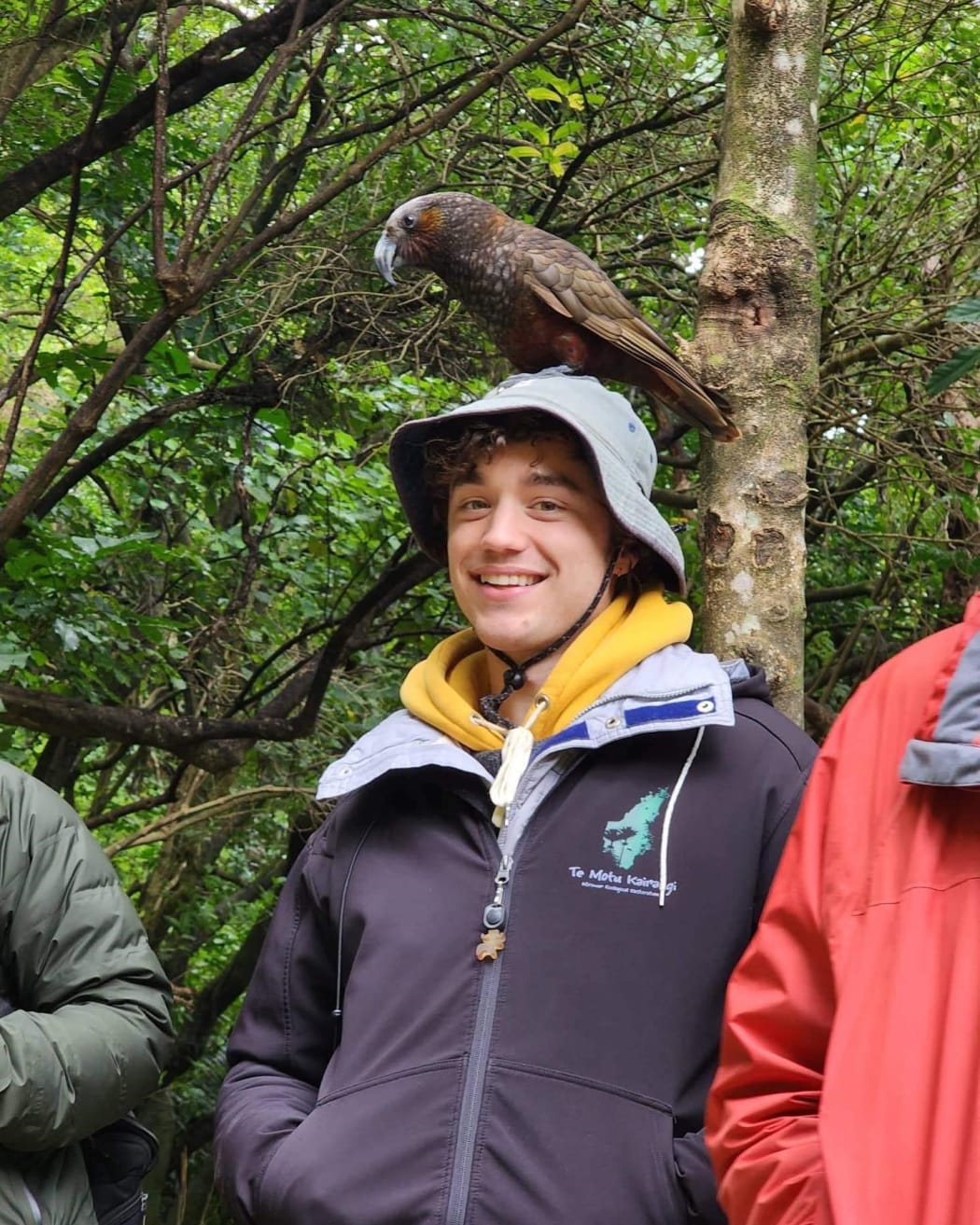 Max Barrett with a kākā on Kapiti Island