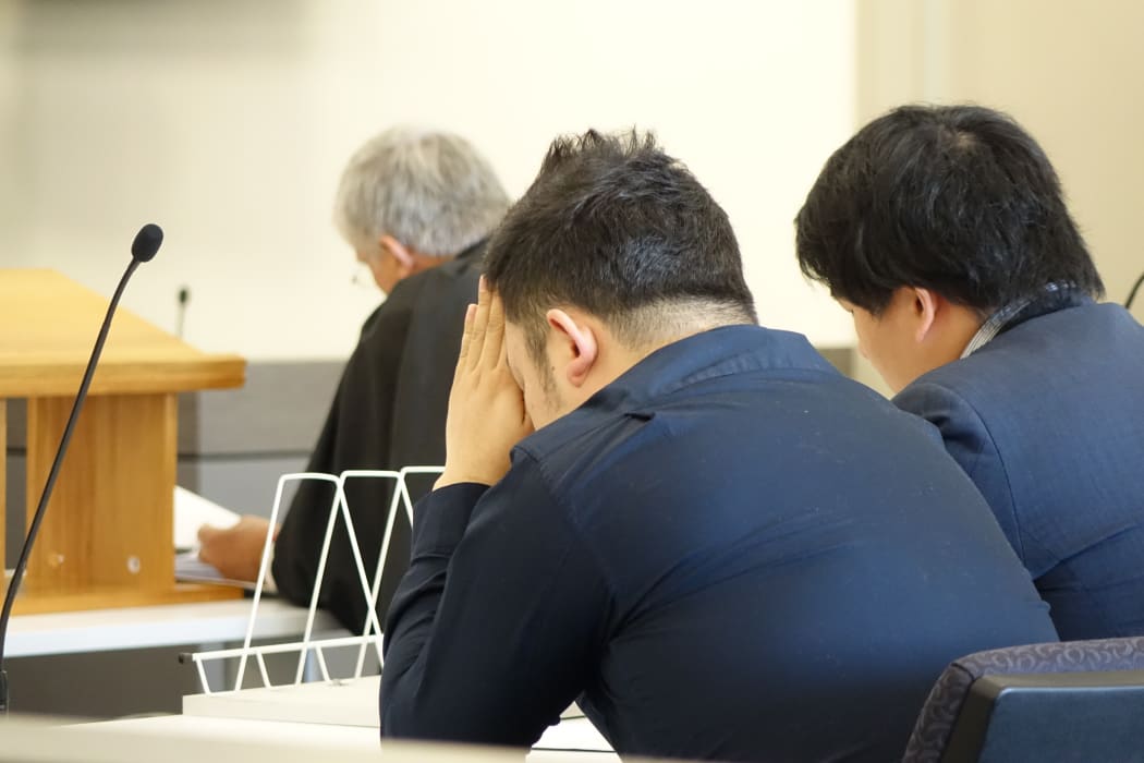 Jing Cao (left) in the High Court in Dunedin on 31 July.