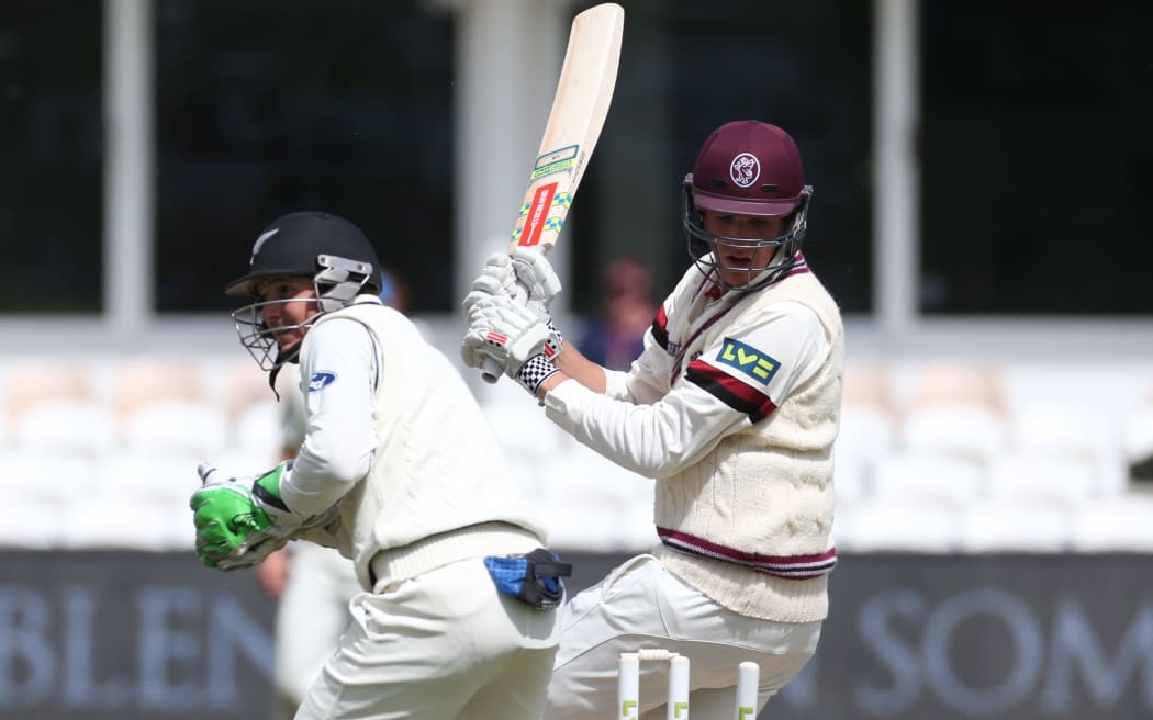 Craig Overton treads on his wicket and is out to Mark Craig during the four day game between Somerset and a New Zealand XI, 2015.
