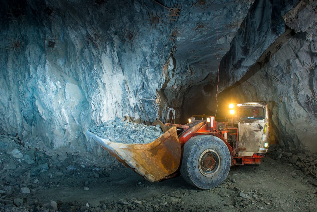 Working inside gold mine tunnel. Gold mining.