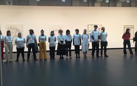 Students protest a Theo Schoon exhibition at Wellington City Council.
