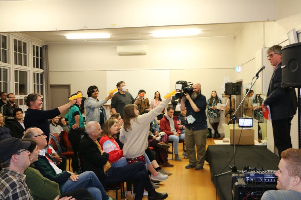 Aro Valley debate attendees practice their water pistol skills.