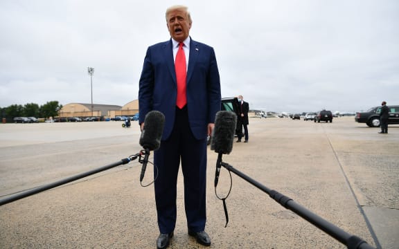 US President Donald Trump speaks to the media before departing for Kenosha, Wisconsin.