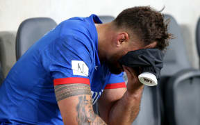 Manu Samoa captain Jack Lam nurses a eye injury on the sideline.