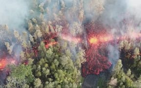 Still from drone footage of lava flow in Leilani Estates, Hawaii