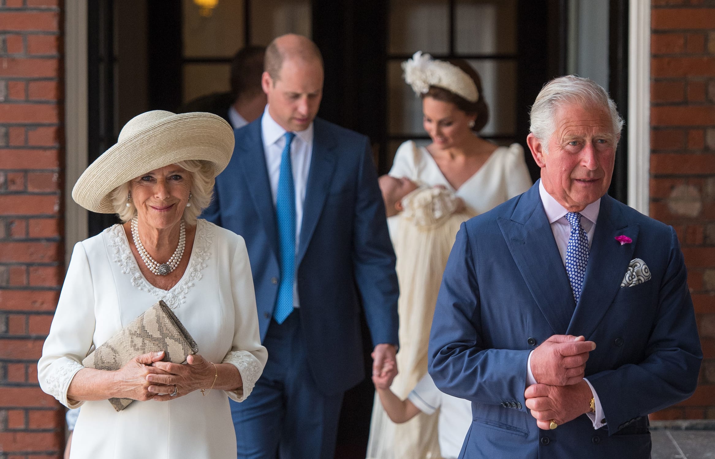 Britain's Prince Charles, Prince of Wales (R) and Britain's Camilla, Duchess of Cornwall arrive for the christening.