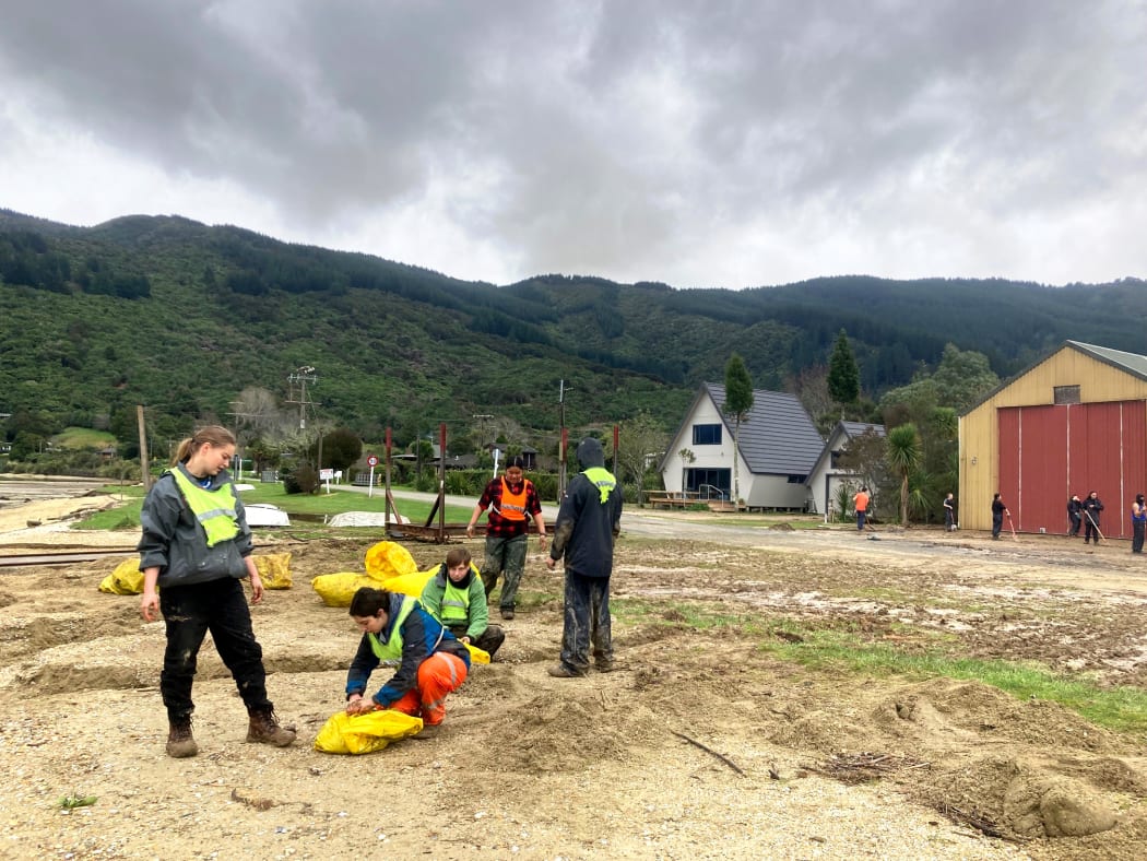 Students making sandbags in Anakiwa.