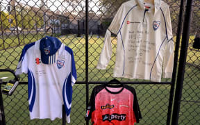 Tributes are seen at the cricket nets in memory of 17-year-old Australian cricketer Ben Austin, who died two days after being struck by a ball at cricket practice. (Photo by William WEST / AFP)