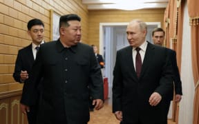 Kim Jong Un walks with Vladimir Putin shortly after Putin's arrival in Pyongyang.