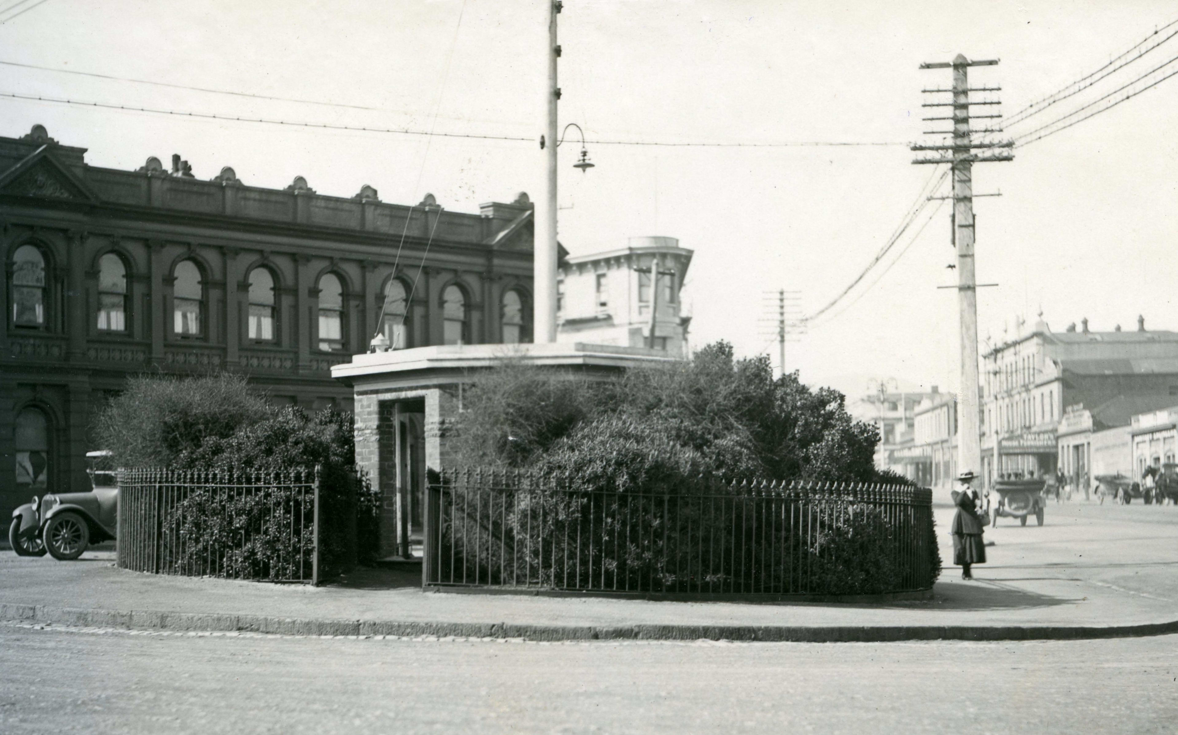 Dunedin public toilets behind "privacy" bushes, circa 1919