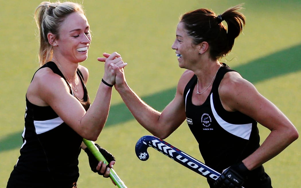 Krystal Forgesson of New Zealand celebrates her goal with Anita Punt. Glasgow 2014 Commonwealth Games. Hockey, Black Sticks Women v Trinidad and Tobago, July 2014.