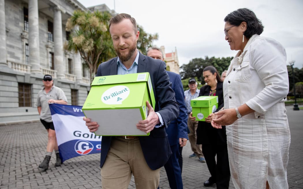 Representatives from Groundswell NZ deliver a petition to Parliament against the emissions trading scheme.