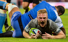 Crusaders winger Johnny McNicholl scores against the Western Force.