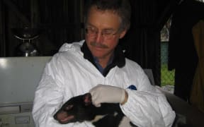 David Quammen with a Tasmanian Devil