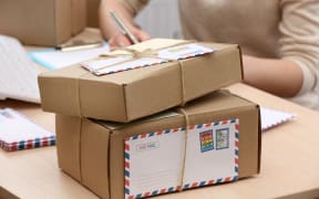 Cardboard boxes on work place in post office