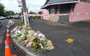 Flowers outside Rose Cottage Superette in Sandringham after fatal stabbing of a worker