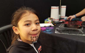 Rangatahi were getting inked up with temporary moko for their performances.