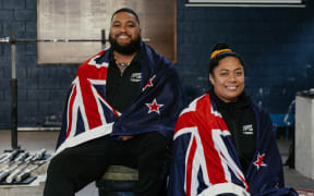 Flagbearers for the New Zealand team at the 2025 Pacific Mini Games David Liti and Tui-Alofa Patolo