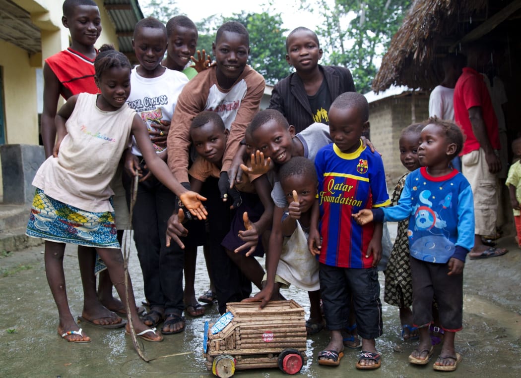 Boma children with a Karma Cola truck.