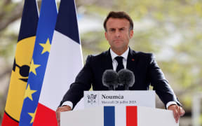 (FILES) France's President Emmanuel Macron delivers a speech at the Place des Cocotiers in Noumea on July 26, 2023. A government spokeswoman announced May 21, 2024, that France's President Macron will visit riot-hit New Caledonia as looting, arson and deadly gunfire have enveloped the French Pacific territory eight days ago.