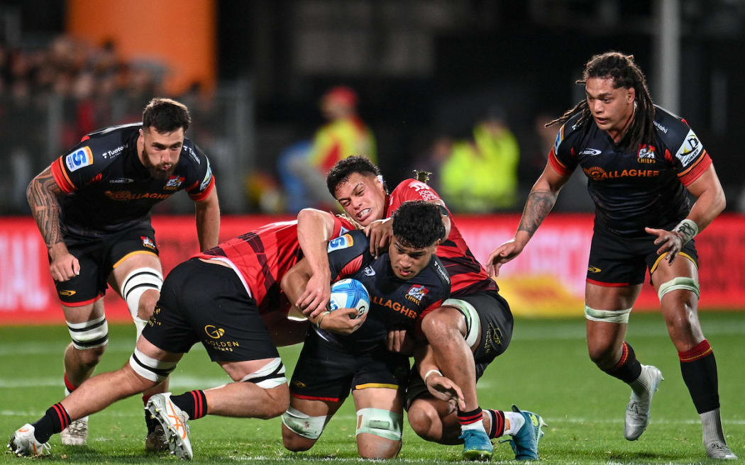 Wallace Sititi of the Chiefs is tackled by Christian Lio-Willie of the Crusaders at Apollo Projects Stadium, Christchurch.