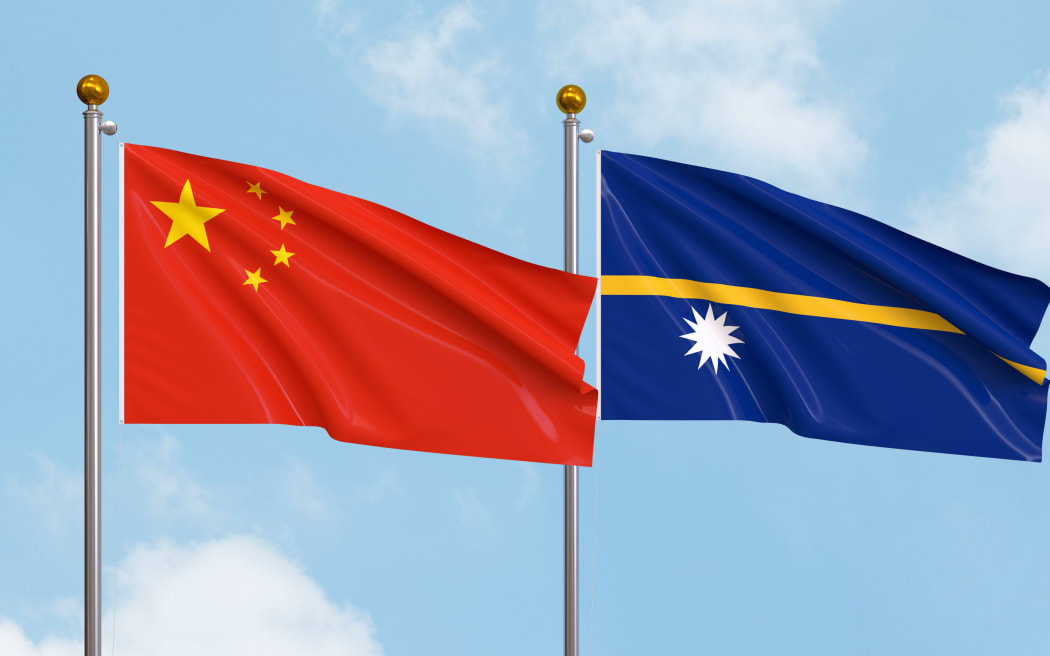 Waving flags of China and Nauru on sky background. Illustrating International Diplomacy, Friendship and Partnership with Soaring Flags against the Sky. 3D illustration