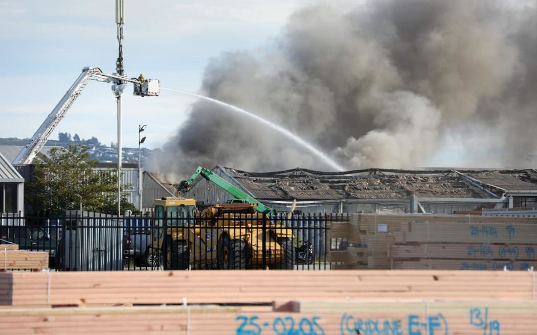 Thick black smoke can be seen pouring out of the industrial site in the suburb of Bromley