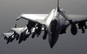 French army Rafale fighter jets flying towards Syria.