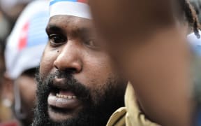A man wearing a headband with the morning star flag shouts during a protest by mostly university students from Free Papua Organization and the Papua Student Alliance in Jakarta on December 1, 2016.