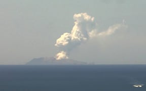 This handout image from a webcam belonging to the Institute of Geological and Nuclear Sciences shows the volcano on New Zealand's White Island spewing steam and ash on December 9, 2019. -