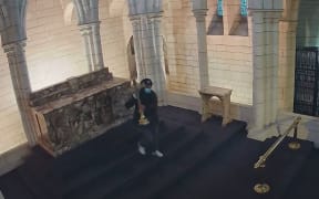 CCTV shows a person walking straight to the high altar on Friday afternoon last week and taking the cross as it was not bolted down.