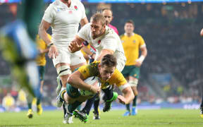 Wallabies first five Bernard Foley scores against England at Twickenham.
