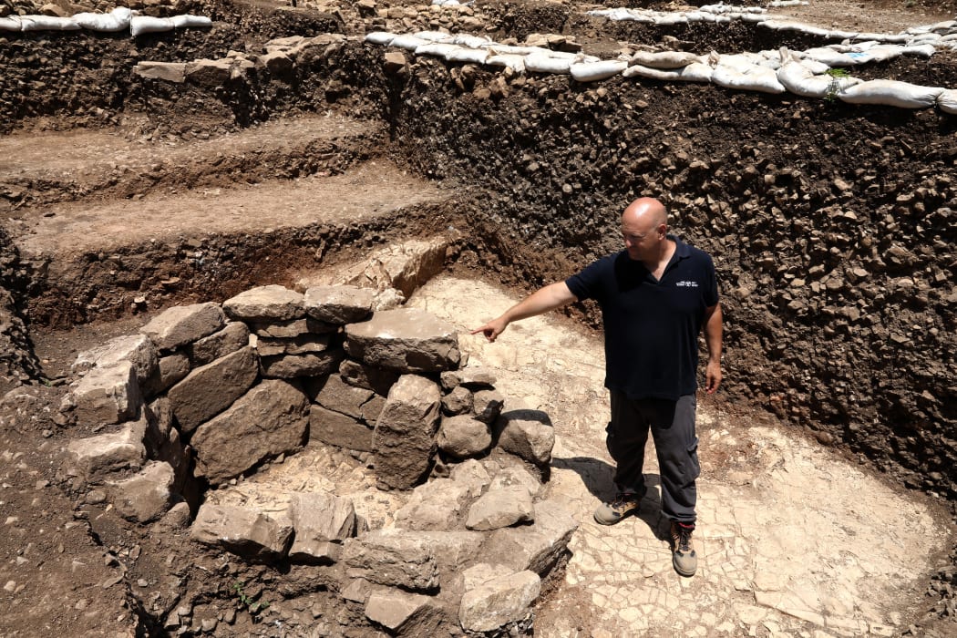 Archeologist of the Israel Antiquities Authority Jacob Vardi is pictured at the site of a settlement from the Neolithic Period (New Stone Age), discovered during archaeological excavations.