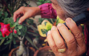 Portrait of senior women talking phone