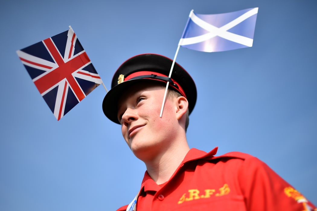 A member of the Grand Orange Lodge of Scotland prepares to march in Edinburgh.
