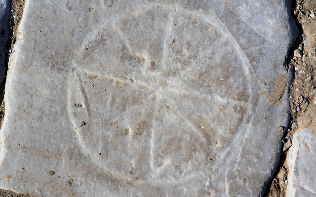 View from above of a Roman sundial in the pavement of the Decumanus, Carthage Carthage, Tunisia, pictured on January 27, 2008, in the morning. Carthage was founded in 814 BC by the Phoenicians who fought three Punic Wars against the Romans over this immensely important Mediterranean harbour. The Romans finally conquered the city in 146 BC. Subsequently it was conquered by the Vandals and the Byzantine Empire. Today the site is a UNESCO World Heritage. This sundial, or Horologe, is situated on Dodecamus V and Cardo IV in the Park of the Roman Villas. Picture by Manuel Cohen. (Photo by Manuel Cohen / Manuel Cohen / Manuel Cohen via AFP)