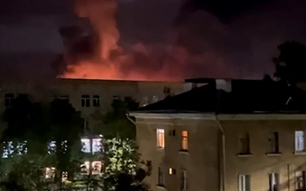 In this grab taken from a handout video posted on the Telegram account of Mikhail Vedernikov, the governor of Russia's Pskov region, on August 30, 2023, an explosion lights up the sky as the Russian military repell a drone attack on an airport in the northwestern city of Pskov. (Photo by Handout / TELEGRAM / @MV_007_PSKOV / AFP) / RESTRICTED TO EDITORIAL USE - MANDATORY CREDIT "AFP PHOTO / TELEGRAM / @MV_007_PSKOV" - NO MARKETING NO ADVERTISING CAMPAIGNS - DISTRIBUTED AS A SERVICE TO CLIENTS