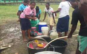 Food pre by volunteers for displaced Papuan villagers in Wamena.
