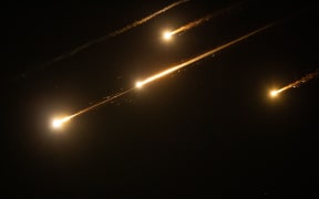 (250613) -- JERUSALEM, June 13, 2025 (Xinhua) -- Bright Traces are seen over Jerusalem during missile attacks launched by Iran to Israel, on June, 13, 2025. Dozens of missiles were fired from Iran into Israel on Friday evening, according to statements issued by the Israel Defense Forces (IDF). (Xinhua/Chen Junqing) (Photo by Chen Junqing / Xinhua via AFP)