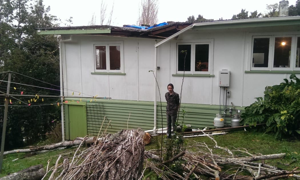 Whangarei resident Kalem outside his damaged home on Wednesday.