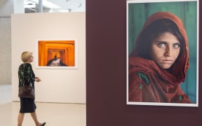 American photographer Steve McCurry's iconic photo 'Afghan Girl', taken of Sharbat Gula in 1985, is displayed at an exhibition in Turkey in 2015.