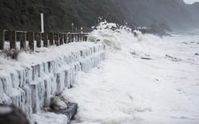 Waves across SH59 just south of Paekākāriki in stormy weather, 13 June 2022.