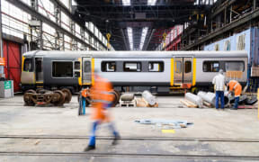 Te Huia rail carriages getting a makeover in KiwiRail's Hutt workshop.