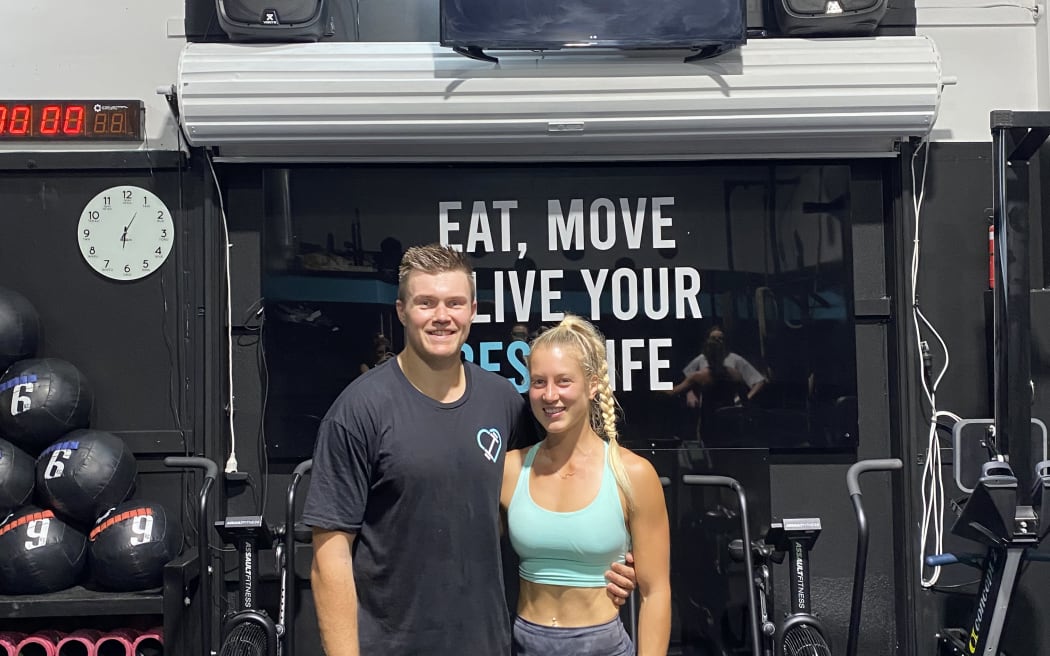 Jon and Livi Kitson-Clark stand inside their gym.