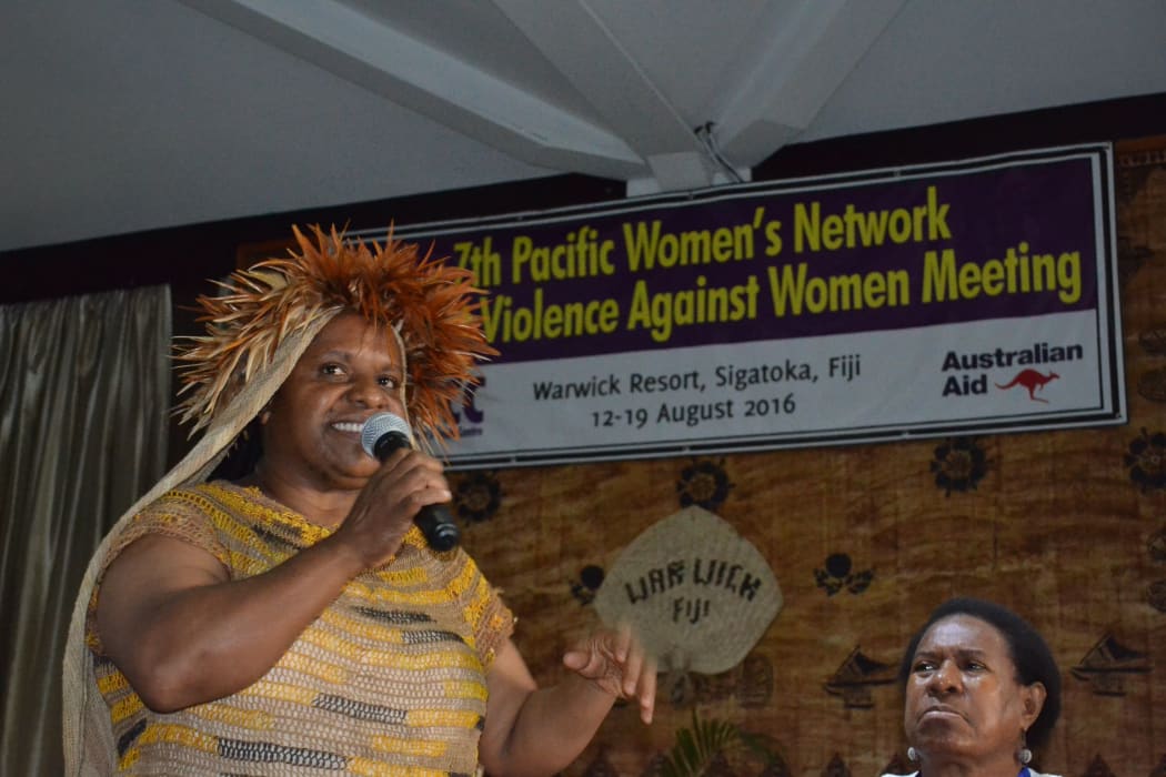 West Papuan human rights activist Rode Wanimbo address the 7th Pacific Women's Network Against Violence Against Women, while Bernadetha Mahuse looks on.
