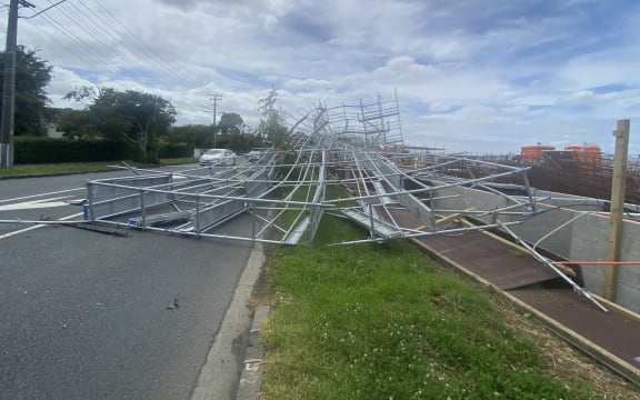 Dashcam footage show cars forced to swerve out of the way as the scaffolding bends, piece by piece, before collapsing into a pile across the road.